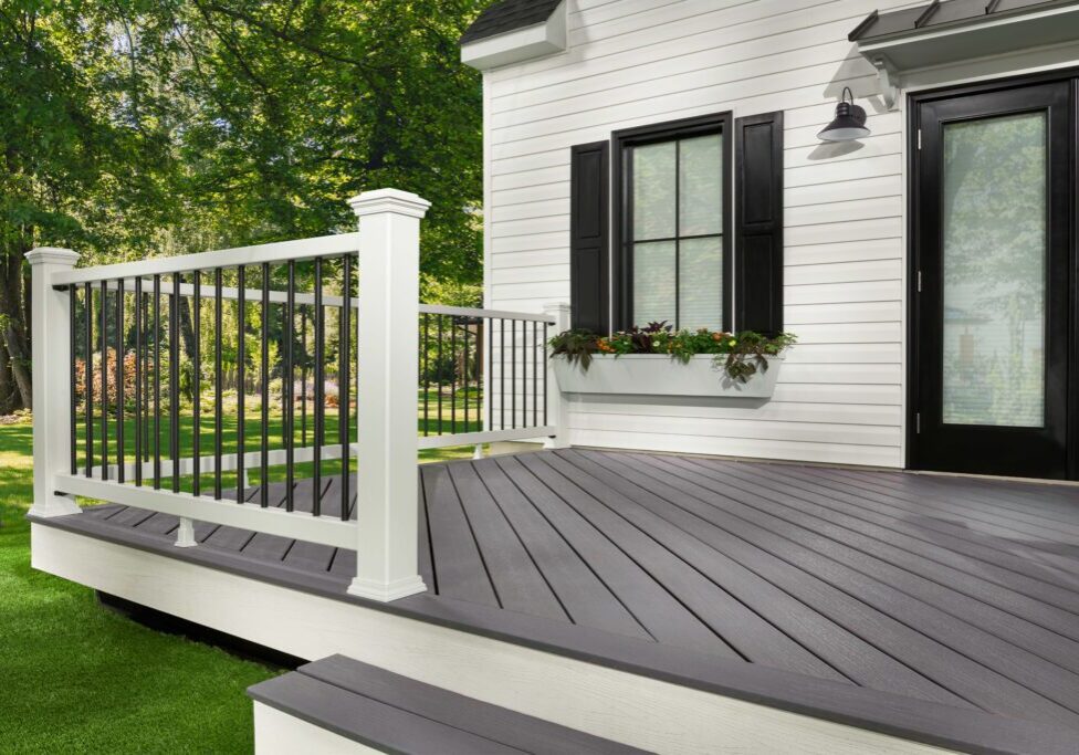 Modern gray composite deck with white railing